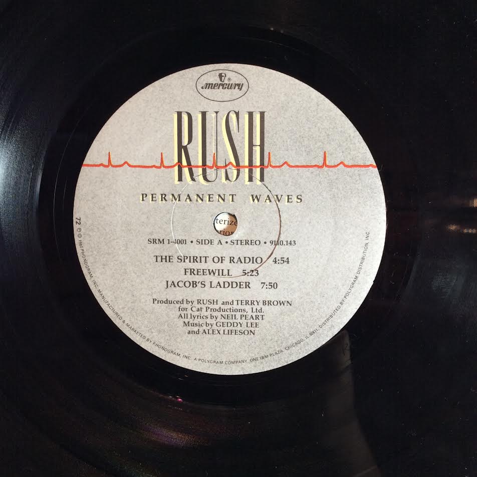 Rush - Permanent Waves (VINYL LP Mercury ‎– SRM-1-4001, Mercury ‎– 9110.143) | USED Very Good Plus (VG+) Very Good Plus (VG+)-The Happy Cap