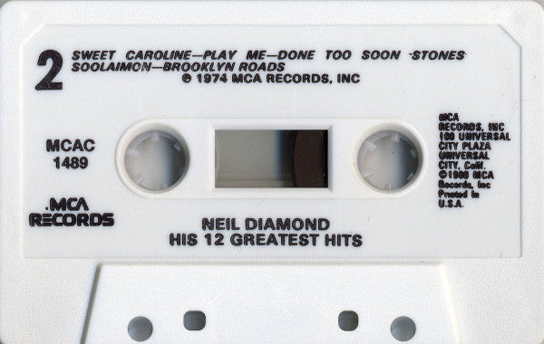 His 12 Greatest Hits (CASSETTE) | Mint (M) Mint (M)-The Happy Cap