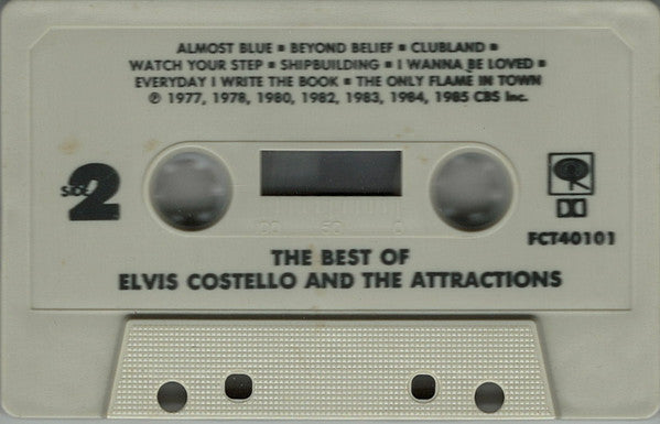Elvis Costello & The Attractions - The Best Of Elvis Costello And The Attractions *CASSETTE* | Near Mint (NM) Near Mint (NM)-The Happy Cap
