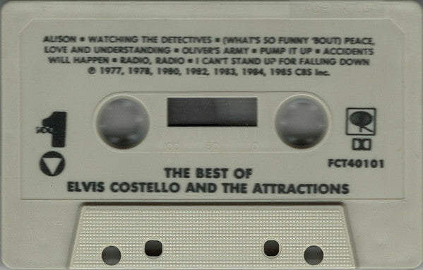 Elvis Costello & The Attractions - The Best Of Elvis Costello And The Attractions *CASSETTE* | Near Mint (NM) Near Mint (NM)-The Happy Cap